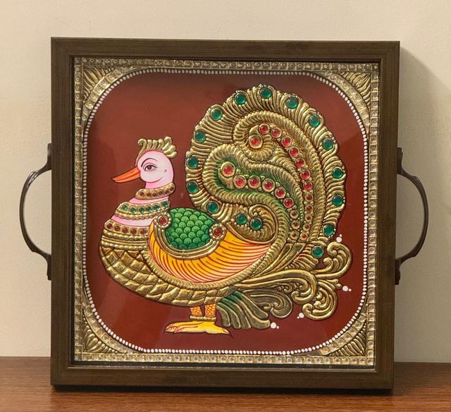 Gold relief swan on a serving tray